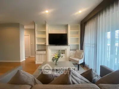 Elegant living room with modern decor and large windows for natural light