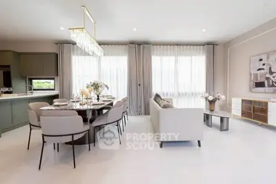 Elegant open-plan living and dining area with modern decor and ample natural light.