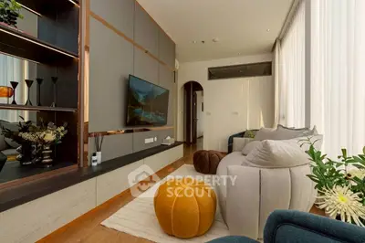 Luxurious modern living room with stylish decor and cozy seating area.