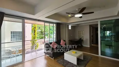 Modern living room with balcony access and stylish decor