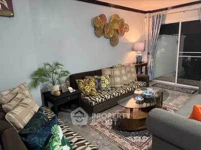 Stylish living room with modern decor, cozy sofas, and elegant coffee table, perfect for relaxation and entertaining.