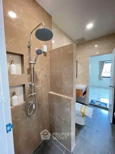 Luxurious bathroom with modern shower and elegant marble tiles