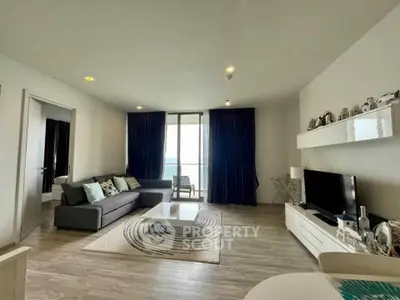 Spacious modern living room with stylish decor and large windows