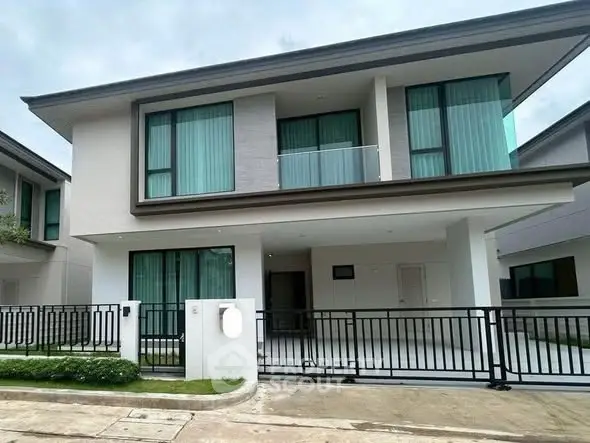 Modern two-story house with sleek design and spacious driveway