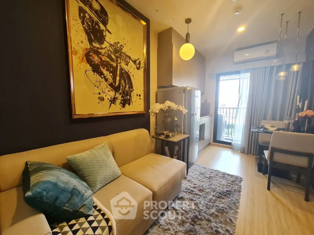 Stylish living room with modern decor and balcony access in a cozy apartment