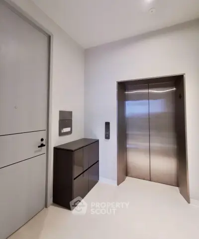Modern building elevator lobby with sleek design and contemporary finishes.