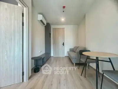 Modern living room with minimalist furniture and wooden flooring