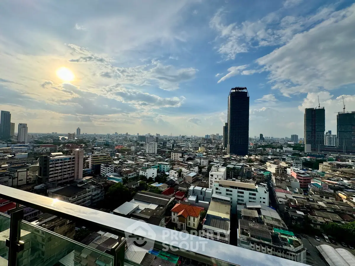 Stunning cityscape view from a high-rise balcony with expansive skyline and vibrant urban landscape.