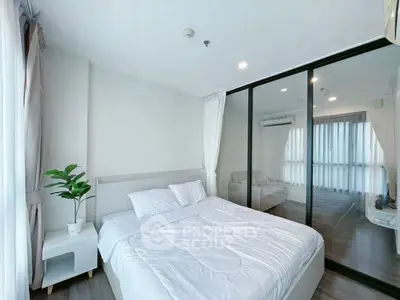 Modern bedroom with glass partition and cozy decor in a stylish apartment