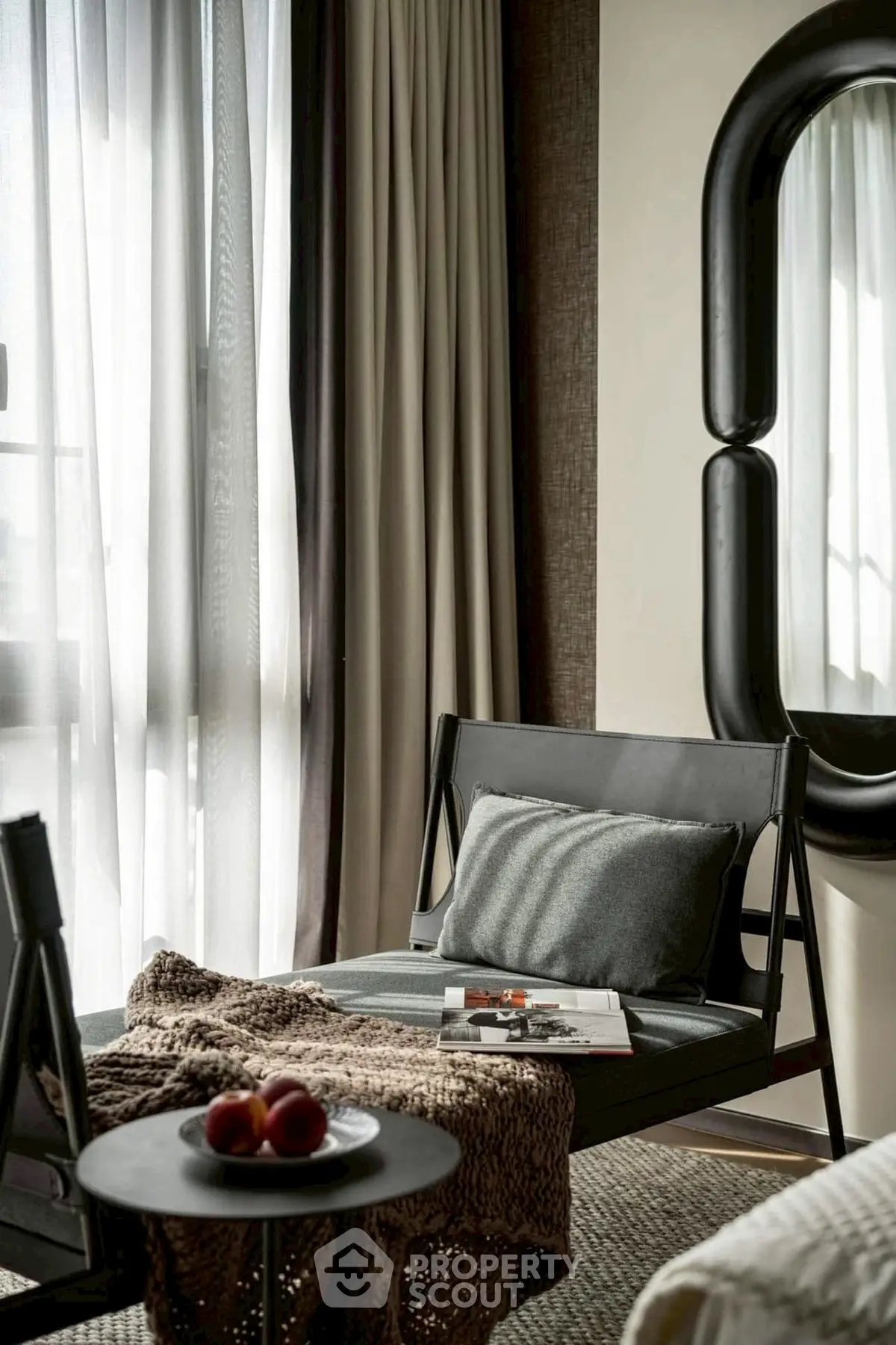 Stylish modern living room with elegant decor and cozy seating area.