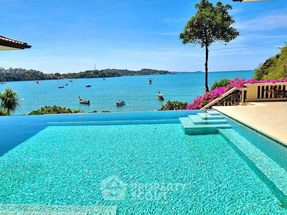 Stunning infinity pool with breathtaking ocean view and lush surroundings