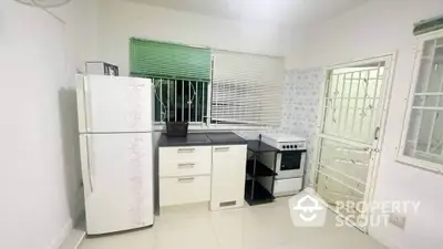 Spacious kitchen with modern appliances and ample storage space