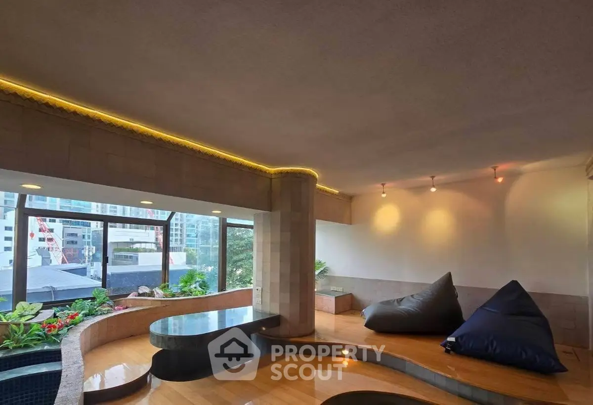 Luxurious modern living room with unique architectural design and stunning city view.