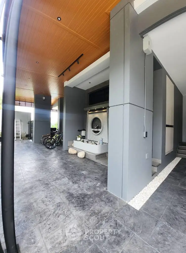 Modern home entrance with sleek design and bicycle storage area