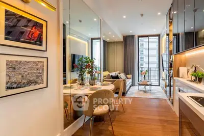 Luxurious open-plan living room with elegant dining area and modern kitchen in a high-rise apartment.