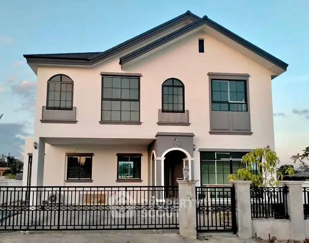 Stunning two-story modern house with elegant facade and spacious windows, perfect for family living.