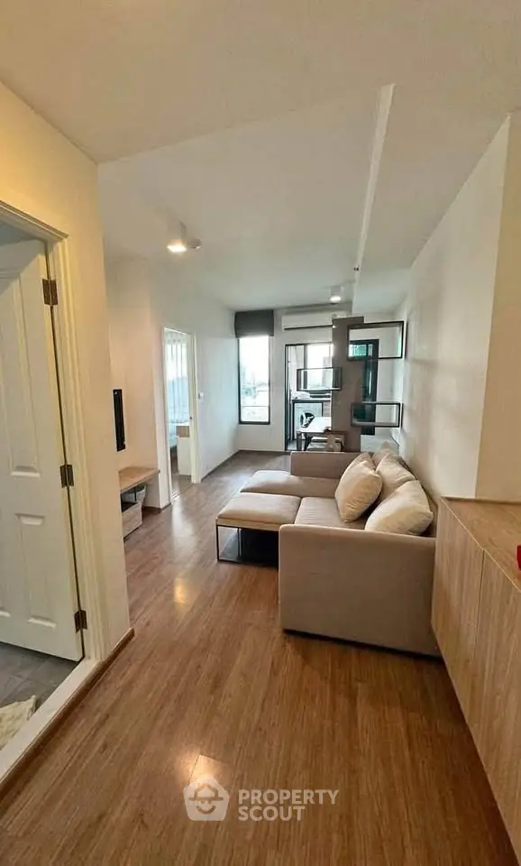 Modern living room with cozy sectional sofa and stylish decor in a bright apartment.