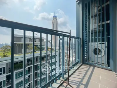 Modern balcony with city view and washing machine, perfect for urban living.