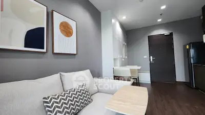 Modern living room with stylish decor and cozy seating in a contemporary apartment.