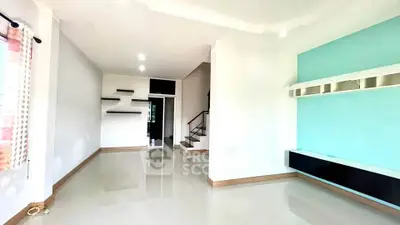 Spacious modern living room with sleek design and ample natural light