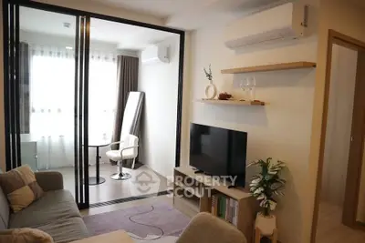 Modern living room with glass partition and cozy decor