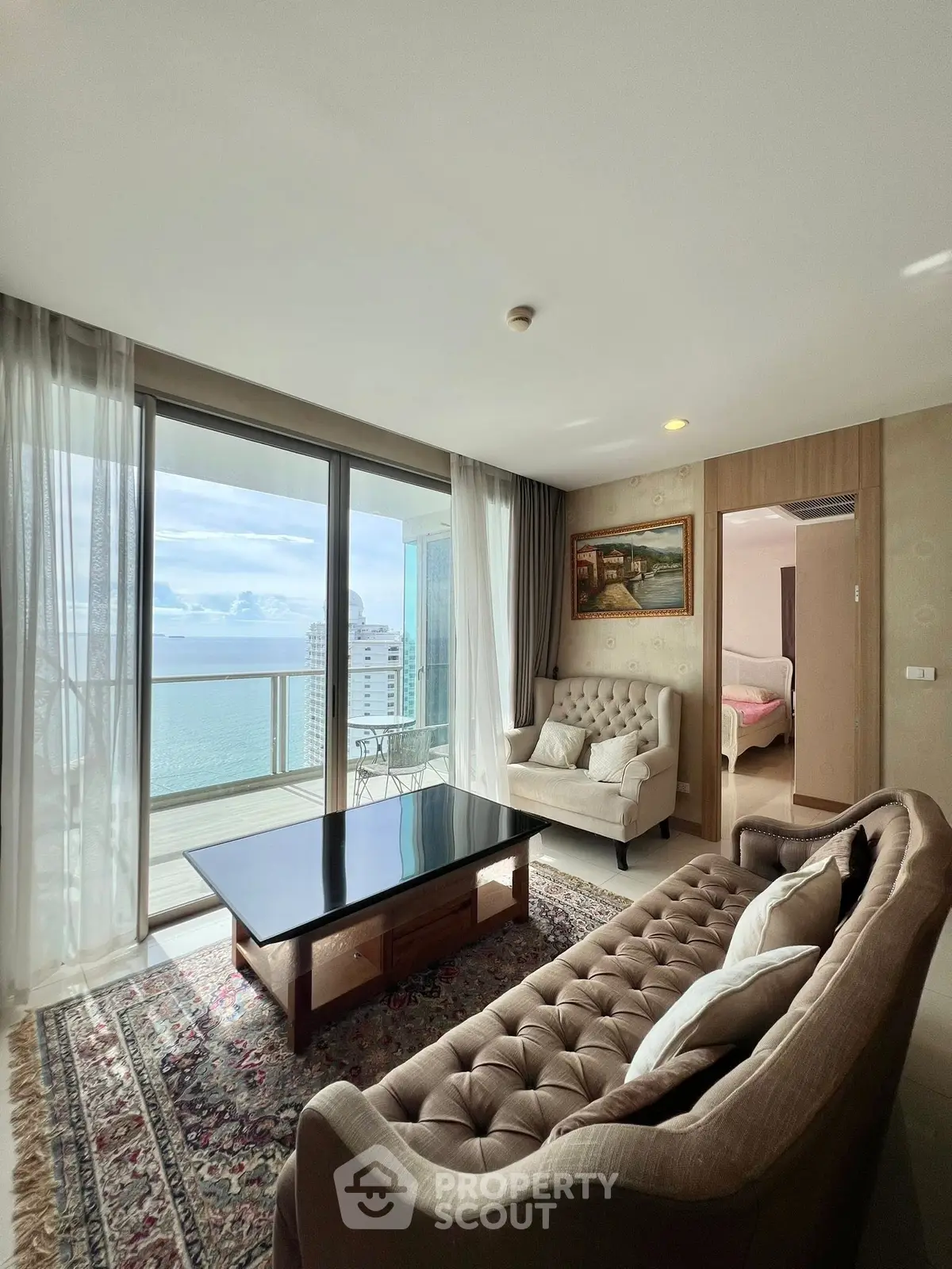 Luxurious living room with ocean view and elegant furniture in high-rise apartment