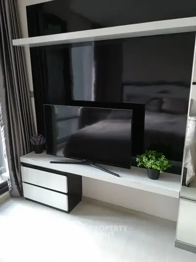 Modern living room with sleek TV setup and stylish decor