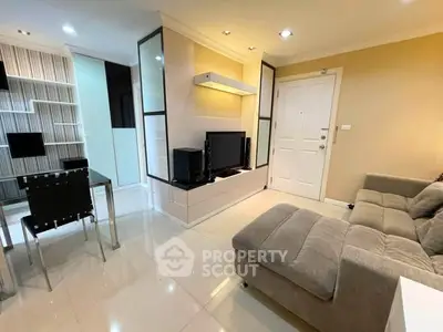 Modern living room with sleek furniture and stylish decor in a contemporary apartment.