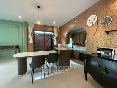 Elegant kitchen with open layout and modern dining area