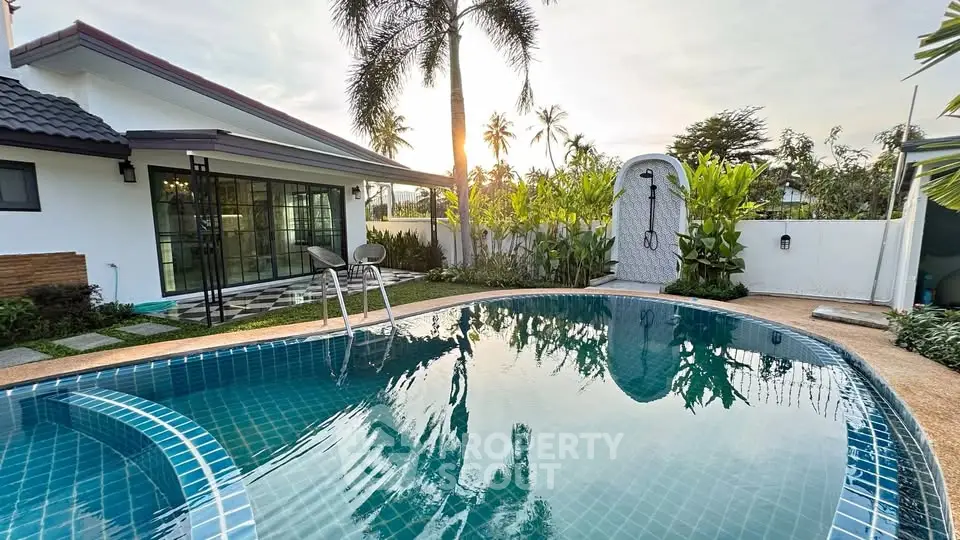 Stunning villa with private pool and lush garden, perfect for luxury living in tropical paradise.