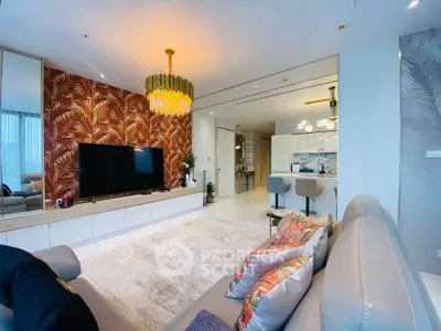 Luxurious living room with modern decor and open kitchen layout, featuring elegant lighting and stylish furnishings.