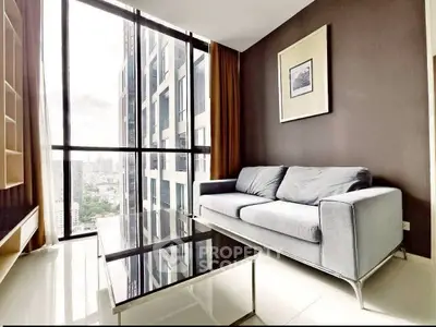 Modern living room with floor-to-ceiling windows and city view