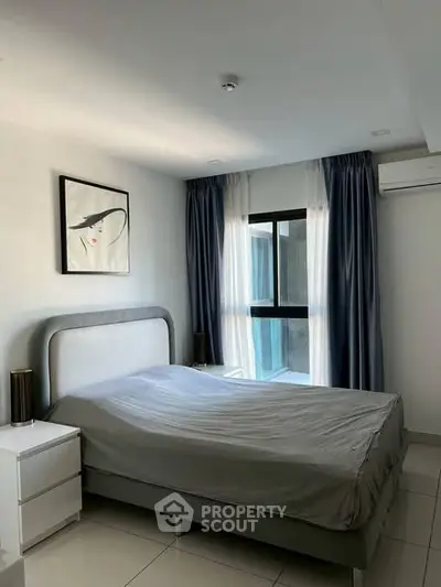 Modern bedroom with stylish decor and natural light