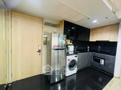 Modern kitchen with stainless steel appliances and sleek cabinetry