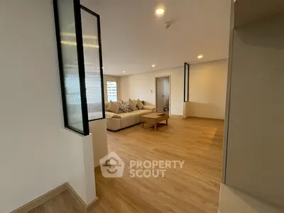 Spacious modern living room with cozy seating and stylish decor