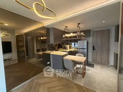 Modern kitchen with sleek design, open layout, and stylish lighting in a contemporary apartment.