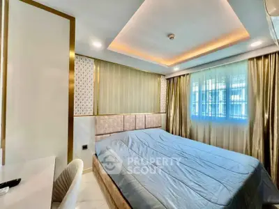 Luxurious bedroom with elegant decor and ambient lighting, featuring a large window with drapes.