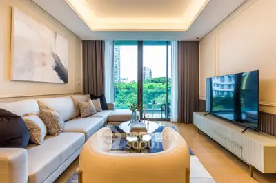 Luxurious modern living room with large TV and balcony view
