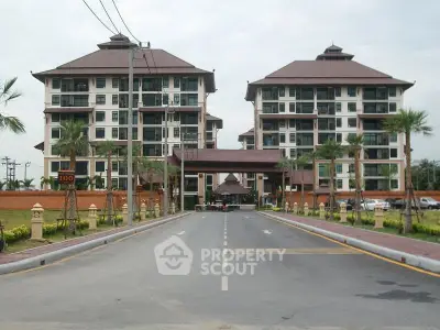 Luxurious residential complex with twin buildings and landscaped entrance