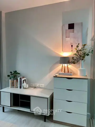 Stylish modern living room corner with elegant decor and ambient lighting.