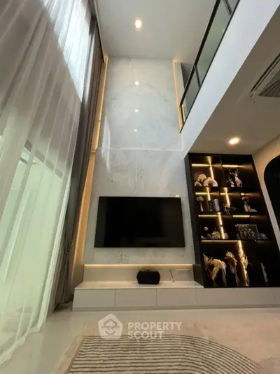 Luxurious modern living room with high ceiling and elegant decor