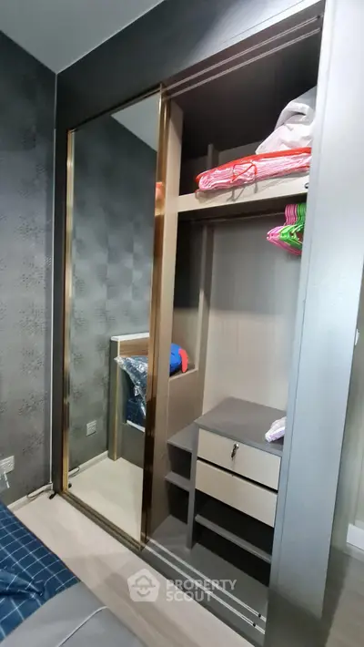Modern bedroom with sleek built-in wardrobe and stylish decor