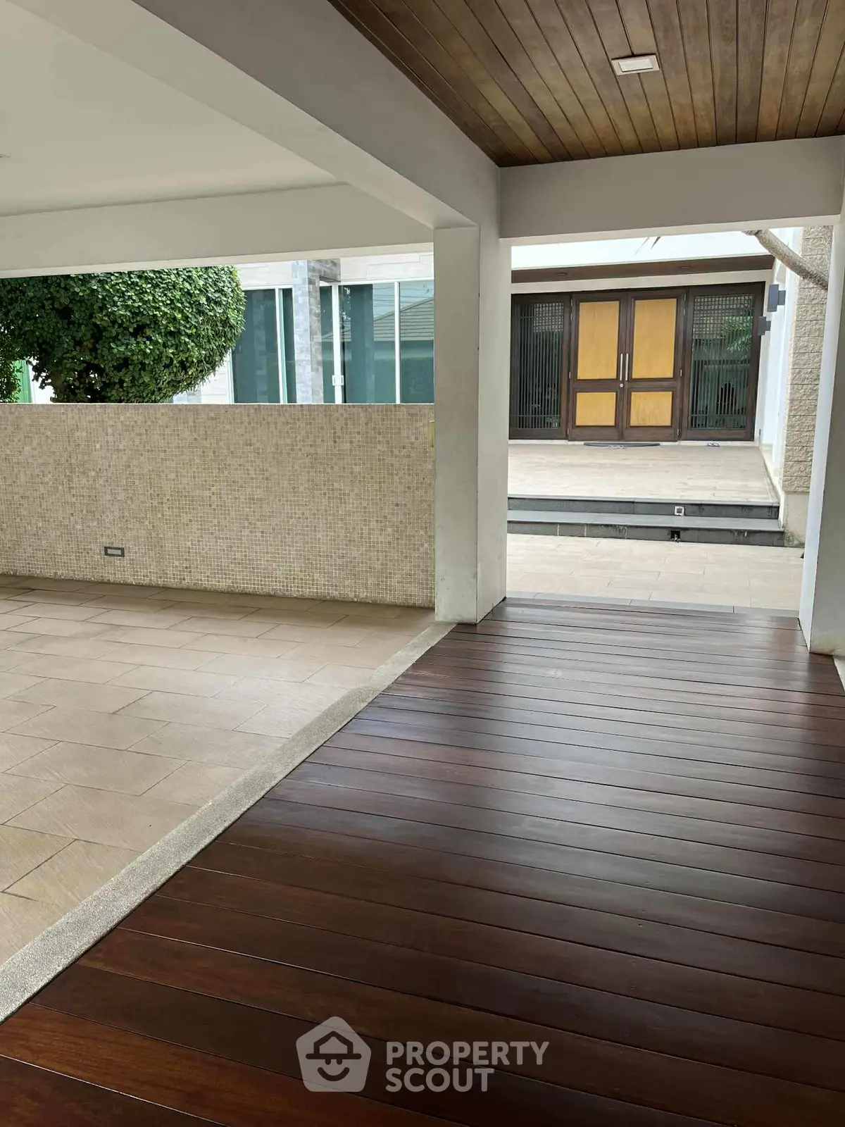 Spacious modern entrance with wooden flooring and elegant design