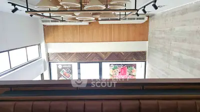 Modern interior with stylish ceiling lights and wooden accents in a contemporary space.