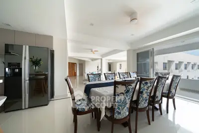 Spacious dining area with elegant furniture and natural light in modern apartment