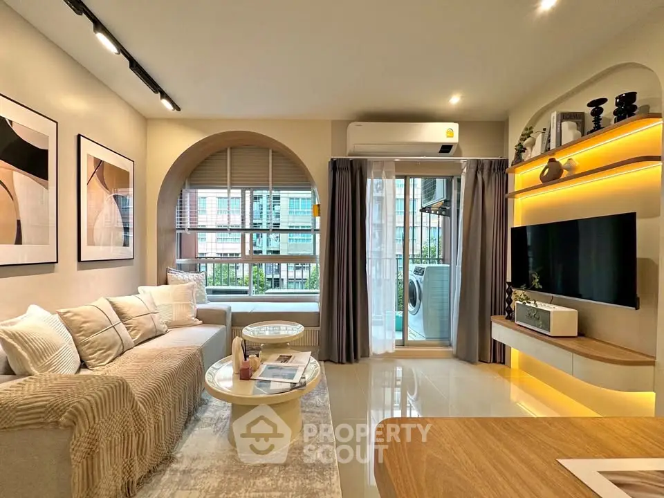 Modern living room with stylish decor and large window view