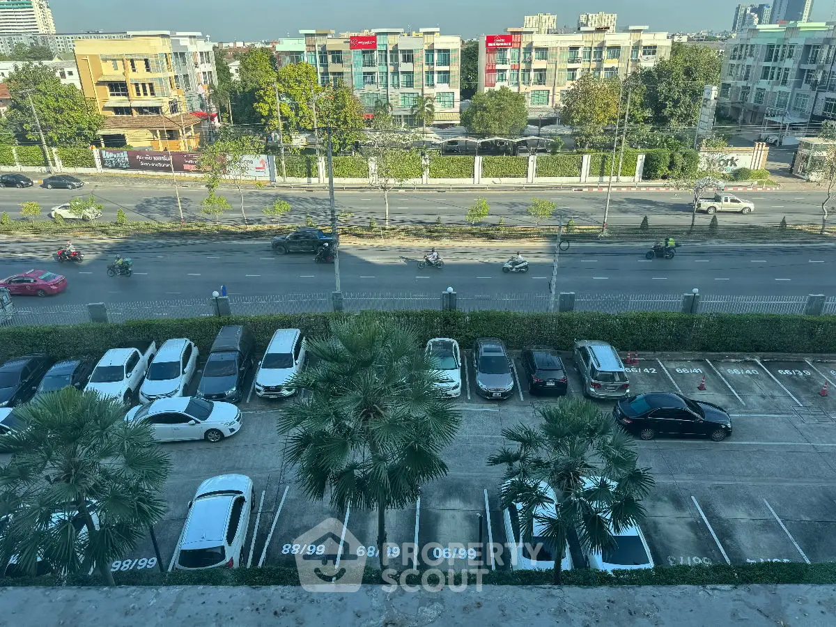 Spacious parking lot with city view, ideal for urban living convenience.
