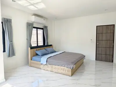 Spacious modern bedroom with minimalist design and natural light