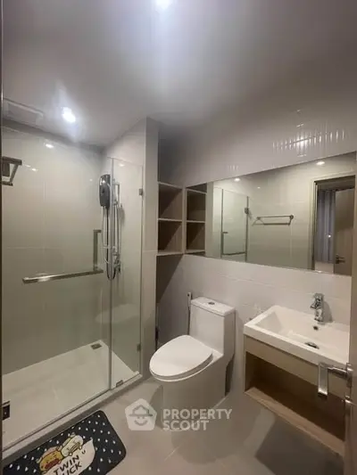 Modern bathroom with glass shower and sleek fixtures