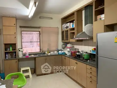 Spacious kitchen with modern appliances and ample storage in a cozy home setting.
